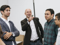 Professor explains something to students