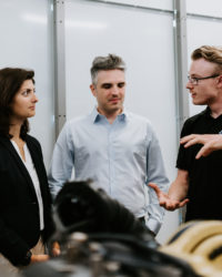 3 People at a factory.