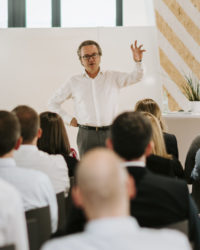 Man talking to class.